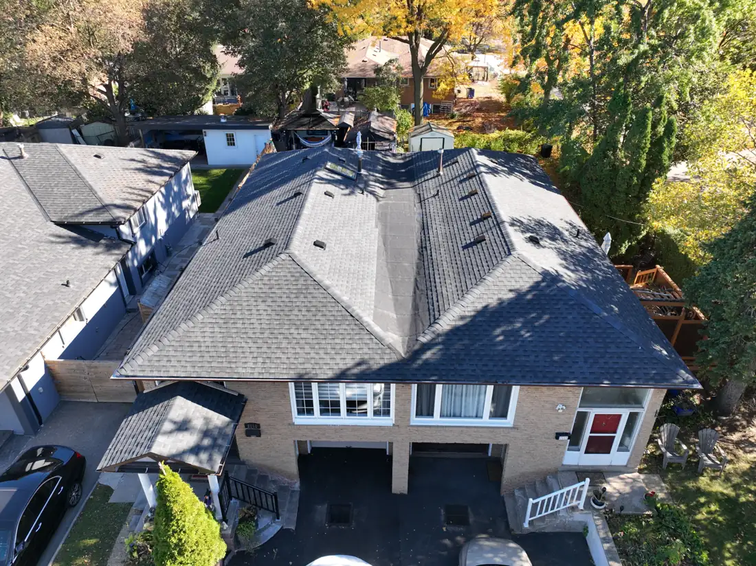 Completed roof replacement on a Bonnymede Drive home in Mississauga, viewed from above the driveway