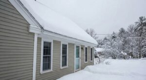 cleaning snow from a roof